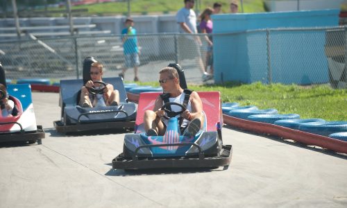people riding go karts